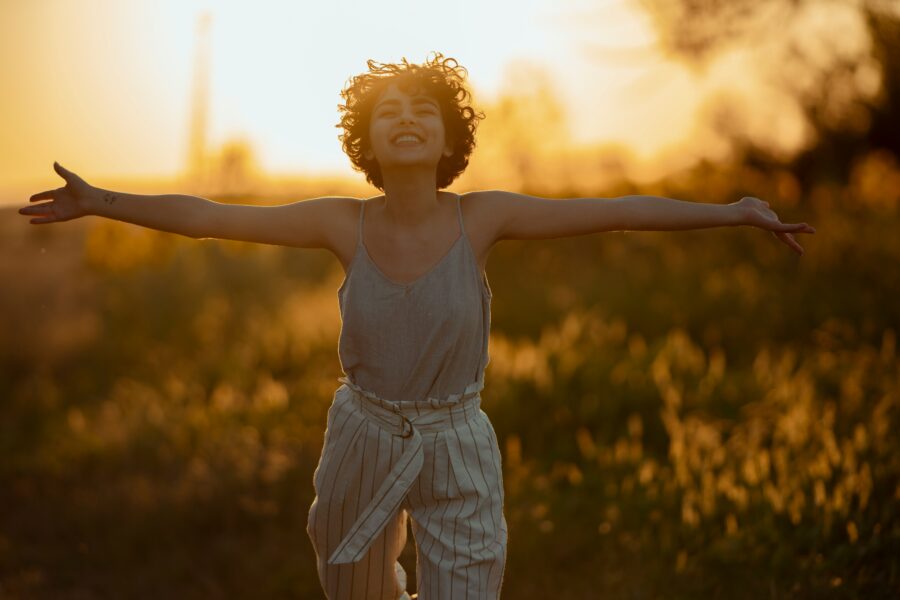 Woman feeling joyful in her body